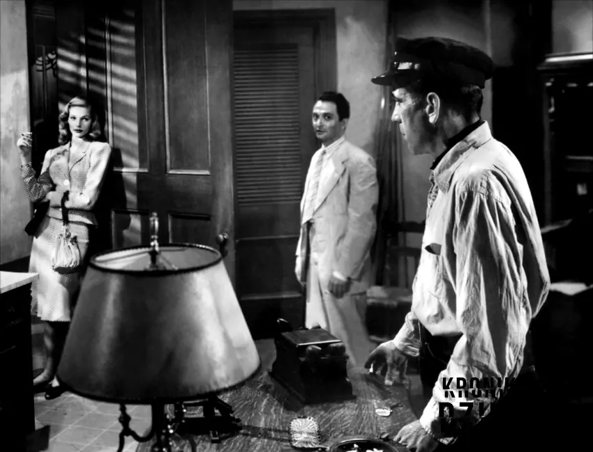 Lauren Bacall, Marcel Dalio i Bogart na planie filmu "Mieć i nie mieć" z 1944 roku, fot. domena publiczna Kadr z filmu "Mieć i nie mieć" przedstawiający aktorów Laurena Bacalla, Marcela Dalio i Bogarta, a także miłosna historia w tle