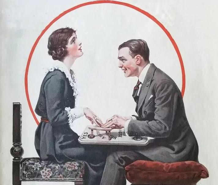 Małżeństwo wywołuje duchy za pomocą ouija