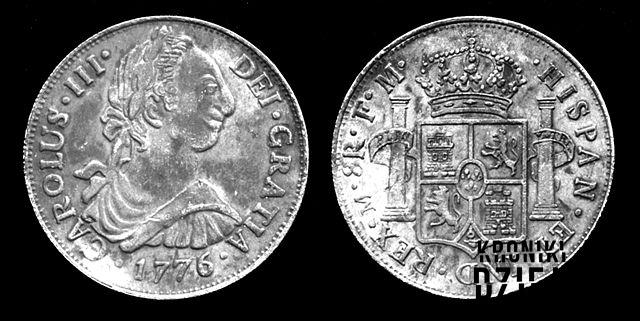 Srebrna moneta o średnicy około 38 mm wybita w Cesarstwie Hiszpańskim po reformie monetarnej w 1497 roku, skąd się wzięły waluty i symbole waut